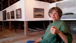 The painter Helga Bosten in her Gallery at the farm Roås in Norway